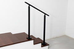Heavy duty double post steel handrail on outdoor concrete entry steps