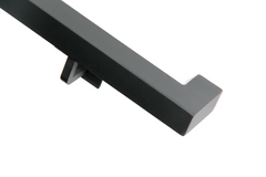 Wall mounted 1.5 inch square steel handrail in matte black on interior stairs