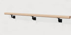 White oak wall handrail on matte black steel brackets, angled view