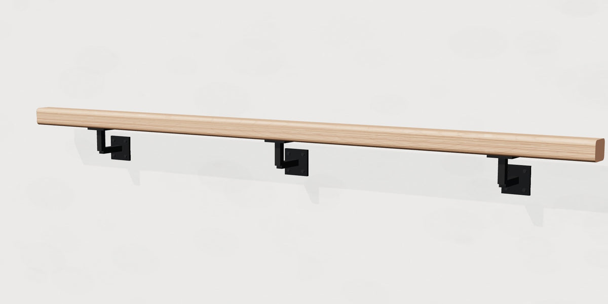 White oak wall handrail on matte black steel brackets, angled view
