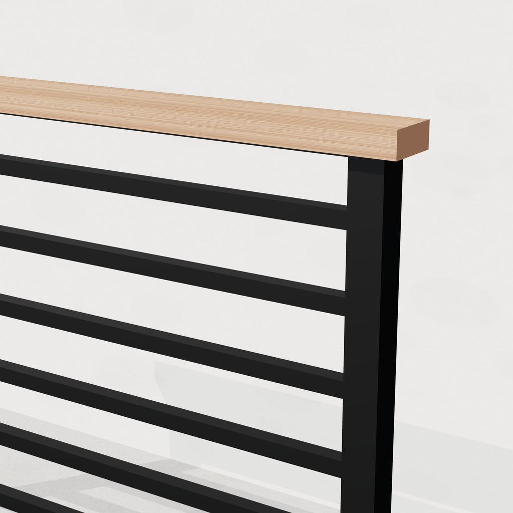 Close-up of white oak cap rail on black steel railing post